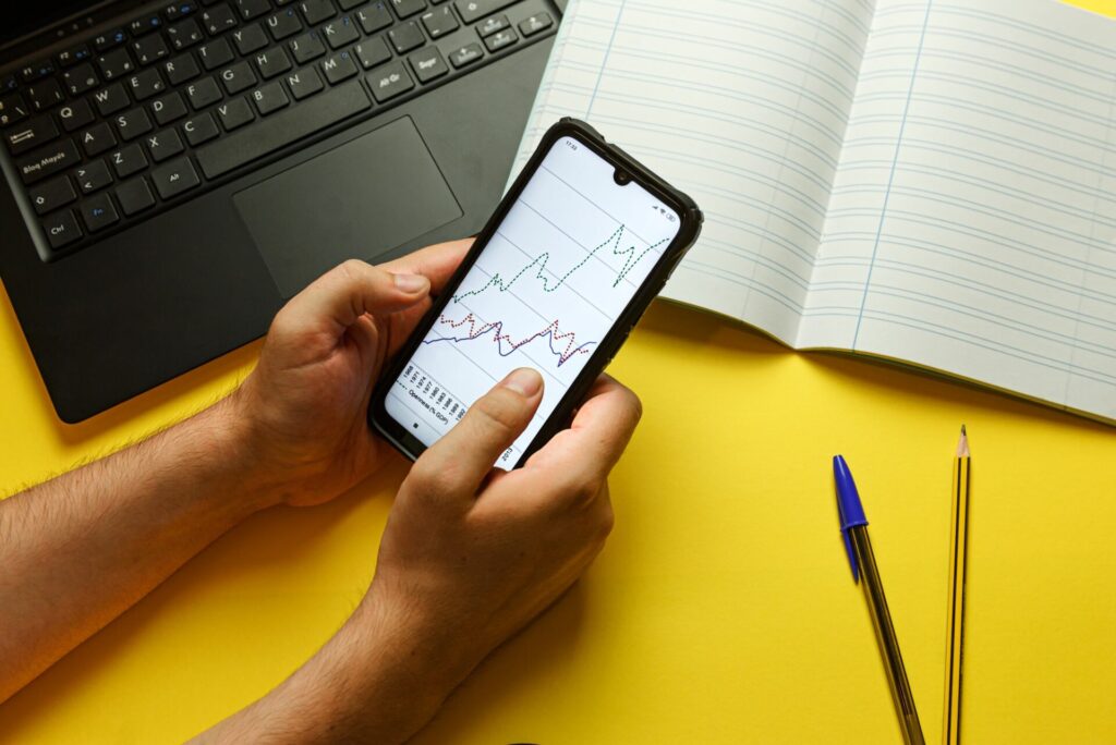 Young man grabbing a phone with economical graphics